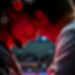 A professional competitor observes an opponent's throat during a match, looking for tells and indicators.