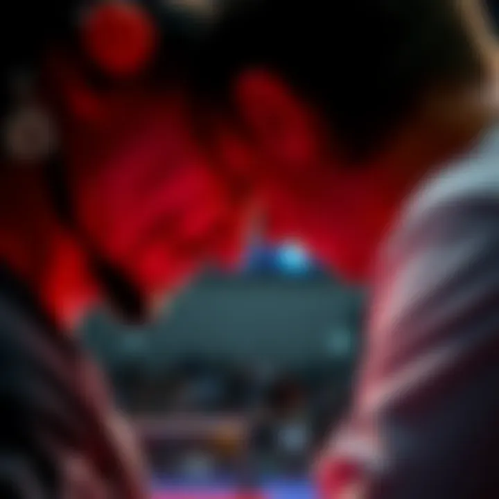 A professional competitor observes an opponent's throat during a match, looking for tells and indicators.