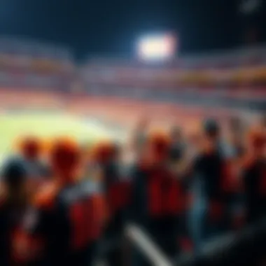 Group of excited Bengals fans wearing team jerseys and cheering in the stands during a football game.