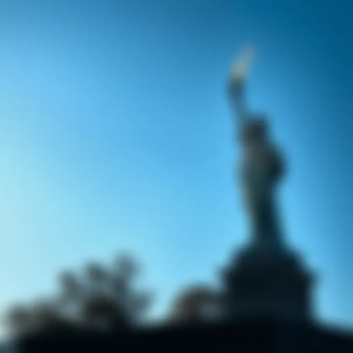 A statue of a person holding a torch symbolizing freedom, standing tall against a blue sky.