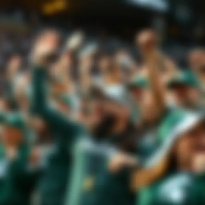 Michigan State Football Fans Cheer A group of enthusiastic Michigan State football fans cheering in green and white gear during a game