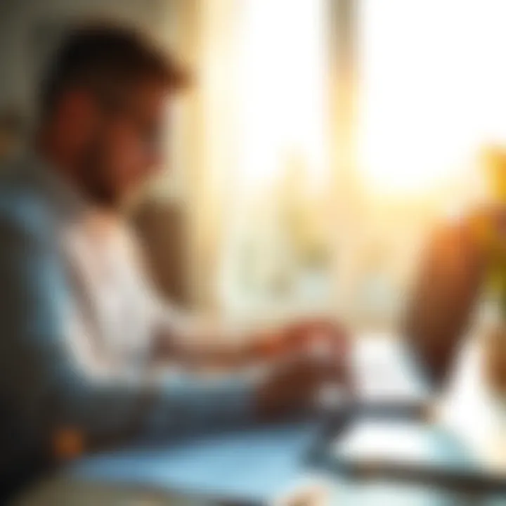 A person reviewing financial documents and a laptop in a bright morning setting, with sunlight streaming in