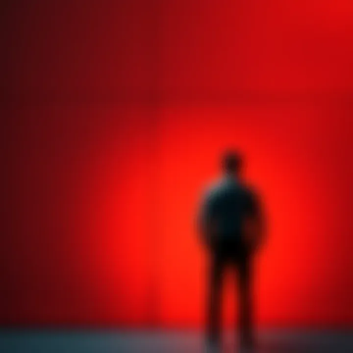 A person standing in front of a wall, looking frustrated and hesitant, representing fear of success and self-sabotage.