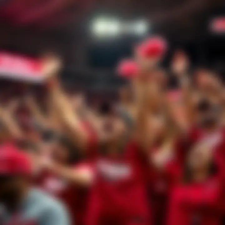 A group of Arkansas Razorbacks fans enthusiastically performing the Woo Pig Sooie cheer during a game, showcasing their team spirit and excitement.