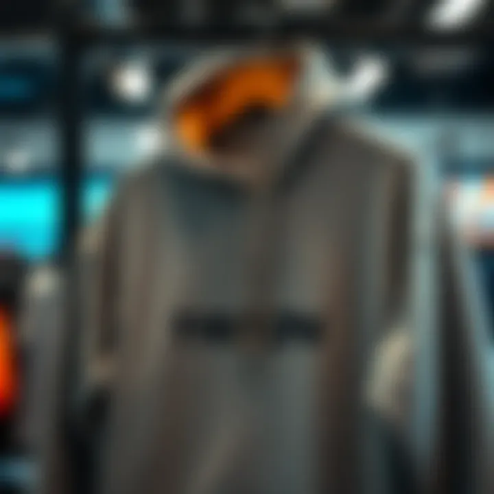A close-up of a stylish Triton hoodie hanging on a rack, showcasing its quality fabric and design